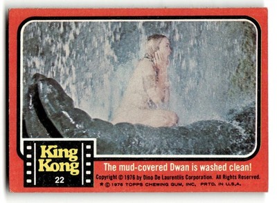 1976 Topps King Kong #22 The mud-covered Dwan is washed clean!