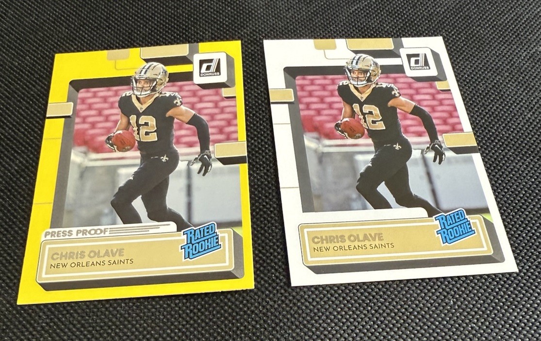 2022 Panini Donruss Chris Olave Yellow Press Proof Rated Rookie #309 & Olave RR
