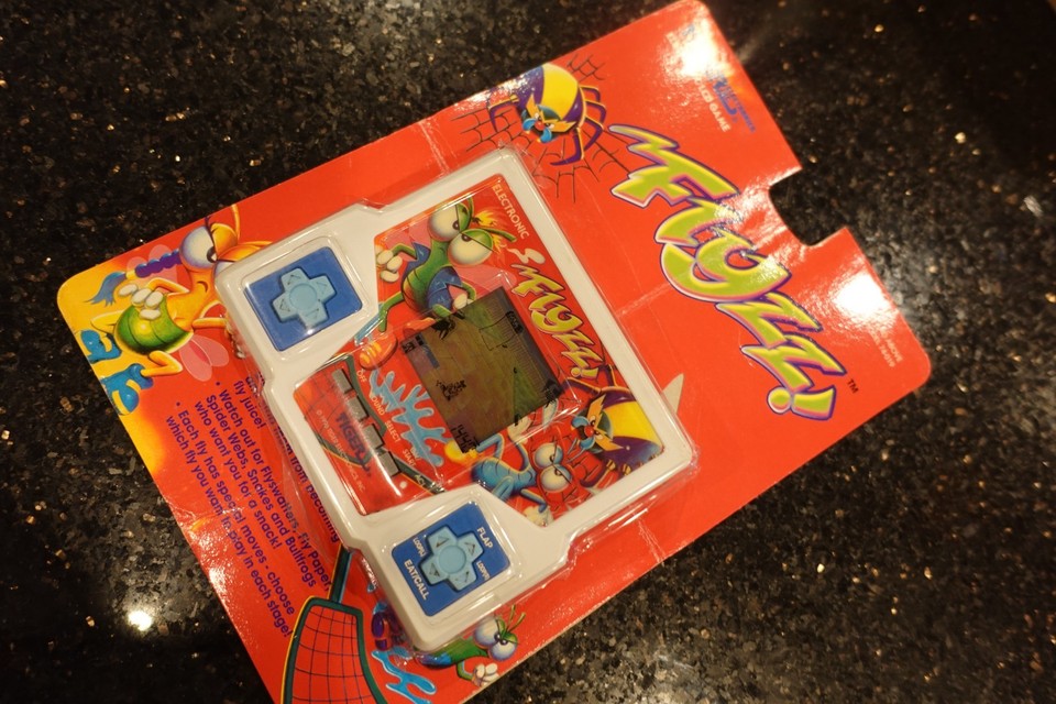 Vintage TIGER FLYZZ Handheld Electronic Tabletop  LCD Video game  A5   with CARD