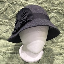 1920s Style Women's Felt Cloche Hat Featuring A Pleated Rosette Accent.