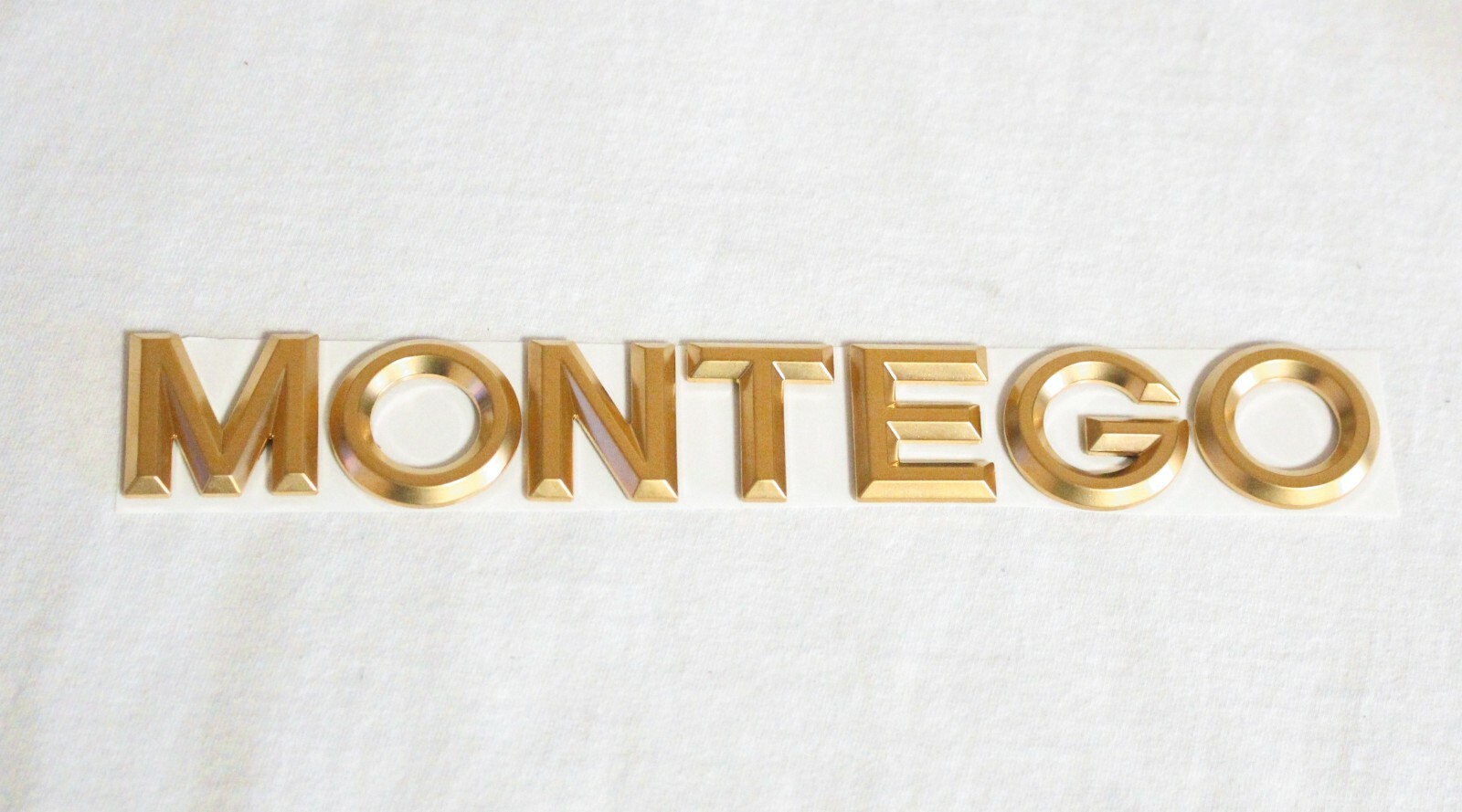 2004-2007 MERCURY "MONTEGO" 24K GOLD PLATED SATIN BRUSHED FINISH REAR EMBLEM