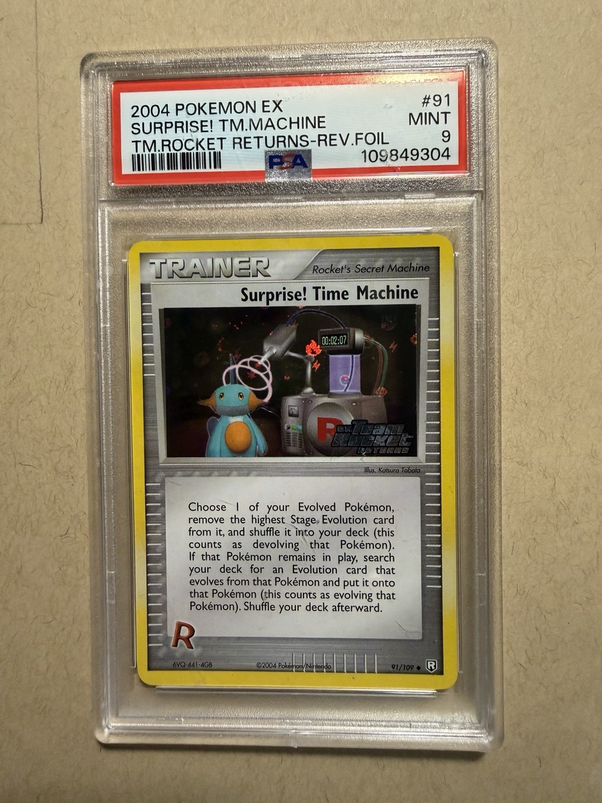 2004 Pokemon EX Team Rocket Returns 91 Surprise! Time Machine-Rev. Foil PSA 9