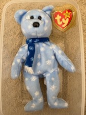 Ty Beanie Babies 1999 Holiday Teddy Bear Plush Toy - Blue , tag in case mint .
