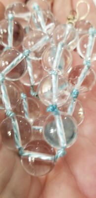 Handknotted 100% lt. blue heavy silk, 28 Clear Quartz drilled  12mm necklace