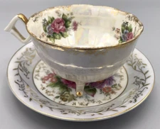 Iridescent Tri Footed Tea Cup & Saucer Set Roses Marked 2C10 Vintage