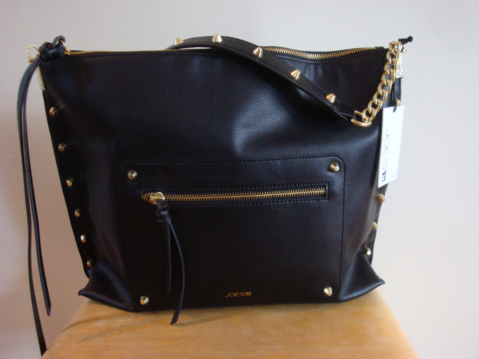 black and gold studded bag
