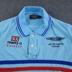 Light blue Hackett London polo shirt with navy trim, embroidered Aston Martin Racing logo, and Union Jack on chest.
