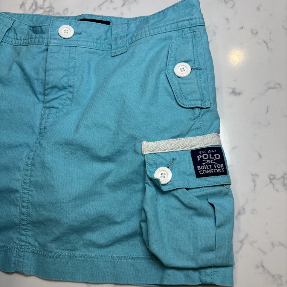 Falda corta vintage Ralph Lauren niñas turquesa bolsillos de carga botones blancos talla 8 Foto 2 de 4