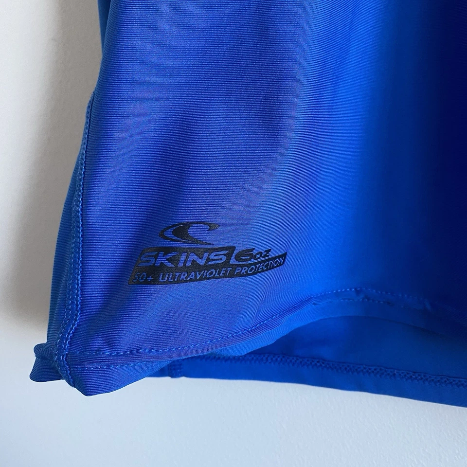 O'Neill Herren Surf Rash Guard Lycra Größe L Blau Logo UV 50+ Kurzarm Shirt - Bild 2 von 4