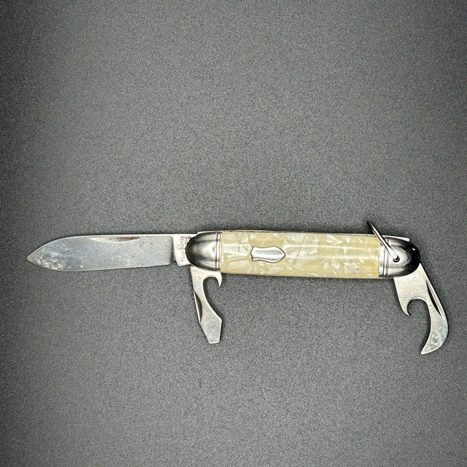 A genuine vintage Sheffield-made multi-tool pocket knife with faux pearl handles — the kind of quality EDC relic that modern mass-produced tools simply can't replicate.