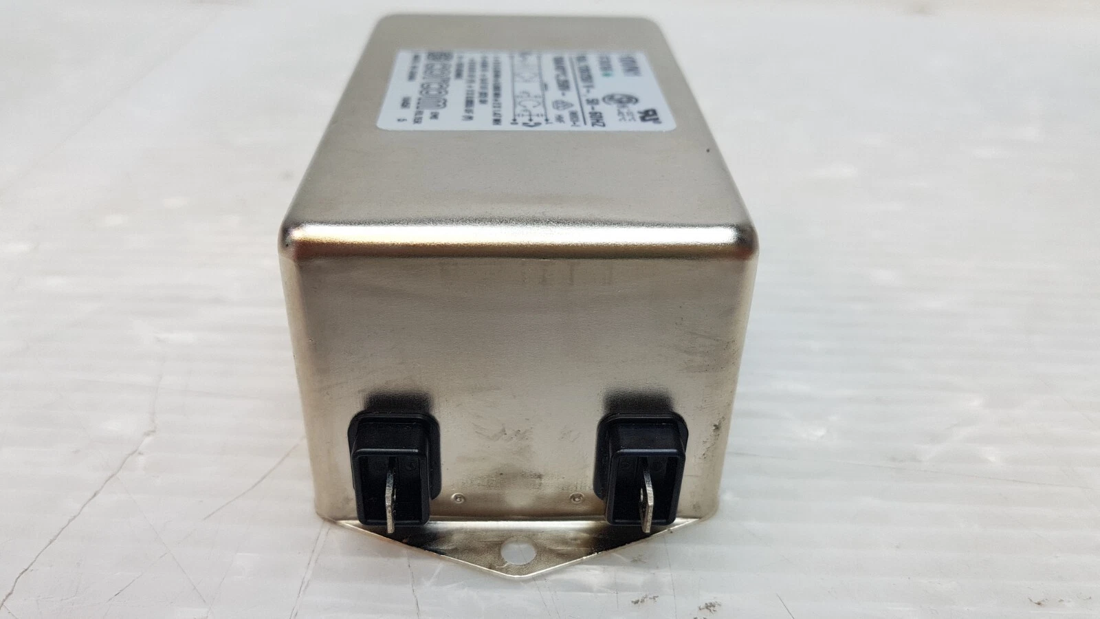 Load end of the Corcom 10VN1 filter with two FASTON terminals and mounting flange