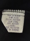 White label with product details: black Y2K tank crop top, size M, made in U.S.A.