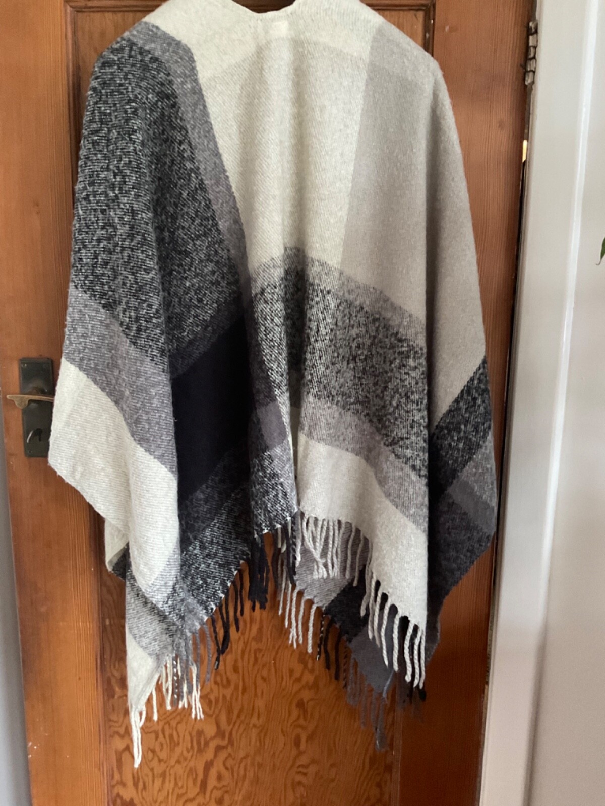 Marks and Spencers black,cream and grey checked shawl/cape with fringe