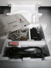 Console GX 4000 - Amstrad GX4000 2 manettes et le jeu d'origine burning rubber H