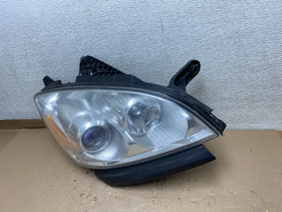 Faro halógeno derecho pasajero Saturn Outlook 2007 a 2010 OEM U1097 DW Foto 2 de 4