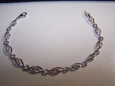 NEW ZALES JEWELER FLAME DESIGN DIAMOND ACCENT STERLING SILVER TENNIS BRACELET