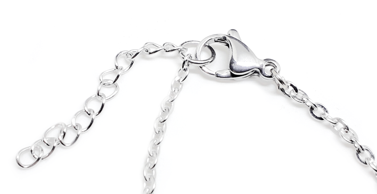Collana lunga pallinata color argento con ciondolo a forma di Ancor