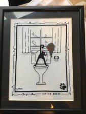 Framed black and  cat photo. made from tapestry kit by Linda Connors. 26x 22 cm.