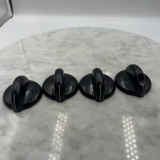 Set of 4 black GE cooktop burner control knobs part # WB03X10136 stove range