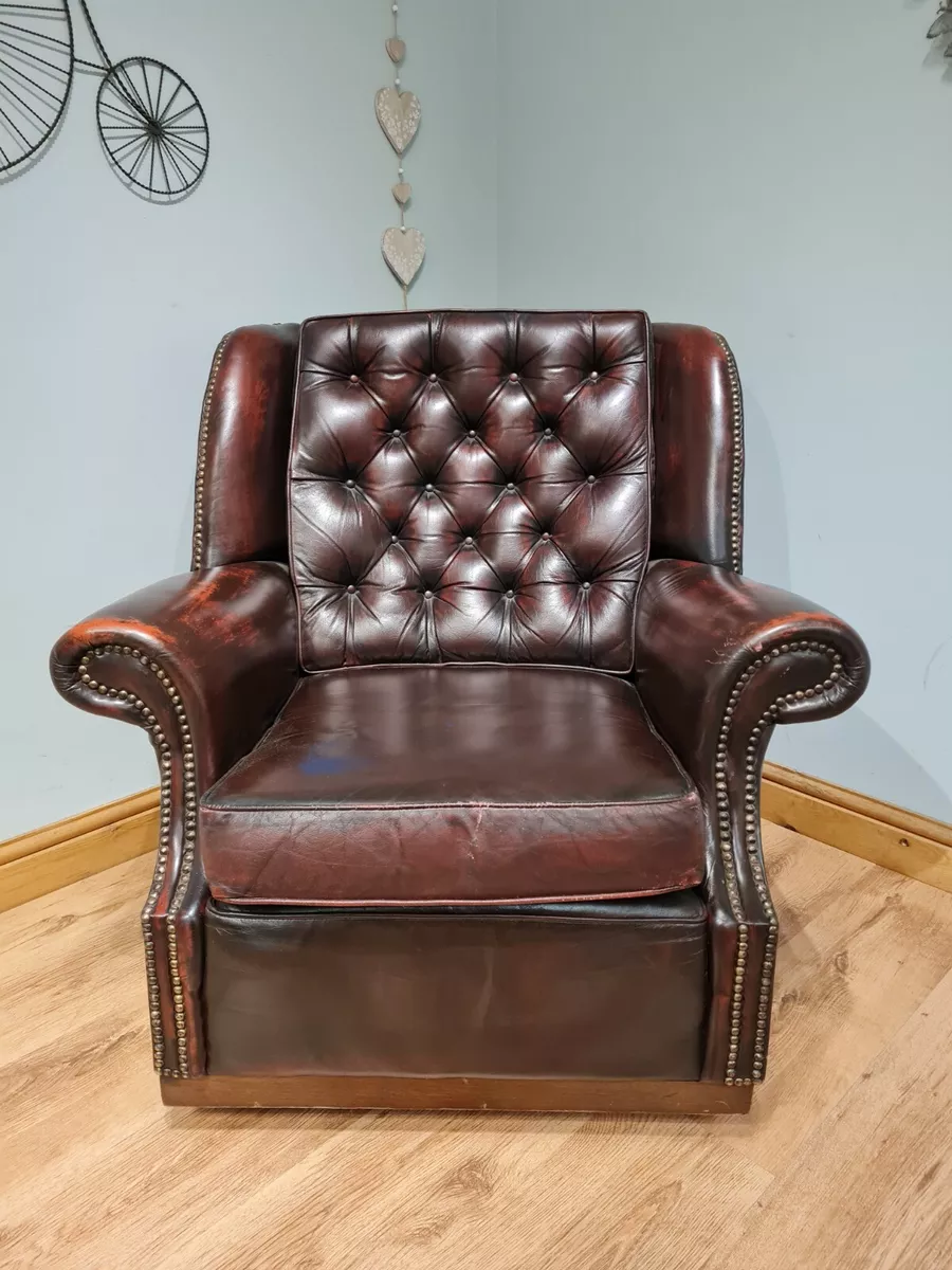 Aged leather armchair deals