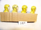 384. Marx Tin Lithographed - 4 yellow cap driver heads for Windup racecars, used