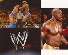 WWE WRESTLING: TITUS O'NEILL SIGNED 6x4 EMBLEM PHOTO+2 UNSIGNED PHOTOS+COA