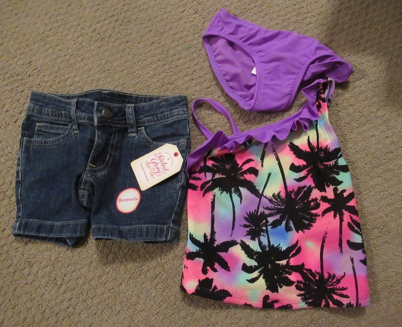 NWT Girl's swim suit and a pair of jean shorts Size 4