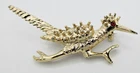 VTG Textured gold tone metal ROADRUNNER RED EYE Brooch Pin Costume Jewelry