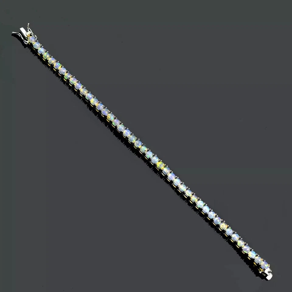 Brazalete de tenis de ópalo de fuego de corte redondo de 4 mm enchapado en oro blanco de 14K de 7" Foto 3 de 4