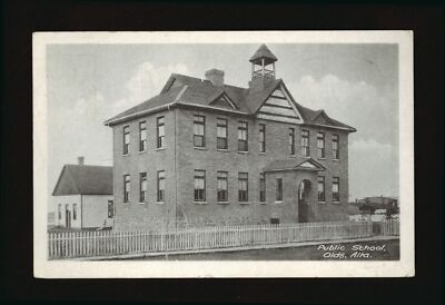 Public school Olds Alberta view of a school with fences around Old Photo