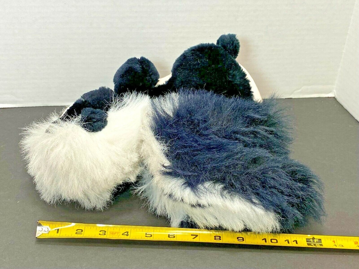 Flower The Skunk Plush Toy - 9 Inch Stuffed Animal Holding Bouquet, Soft & Cute Collectible