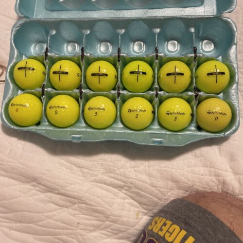 12 Premium AAA gelbe TaylorMade Distance + gebrauchte Golfbälle