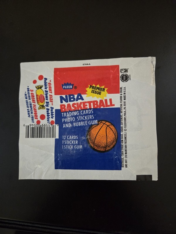 1986 Fleer Basketball Wax Wrapper Jordan RC Year. Rip Upper Right Corner.   (S)