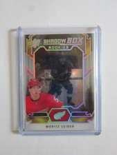 2021-22 Upper Deck SPx Shadowbox Moritz Seider Rookie Card Red Wings 21-22. rookie card picture