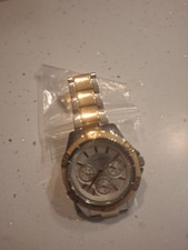 Image of This is a Guess silver-tone watch with a crystal-encrusted dial and bezel.