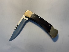 Buck 110 Pocketknife Wood Brass Handle Stainless Steel Blade. 2 dots-1986 Mfg.