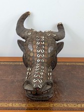 Bamileke buffalo helmet mask from Cameroon decorated with French colonial coins
