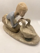 1980 VINTAGE BYRON MOLDS YOUNG  FARM GIRL/GEESE  HANDPAINTED CERAMIC FIGURINE .