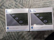 2 Packages Of Simply Essential Solar Disk Lights. 8 Total Lights!