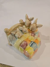 Bunny Parents Putting Baby Bunnies to Bed