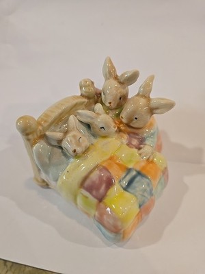 Bunny Parents Putting Baby Bunnies to Bed
