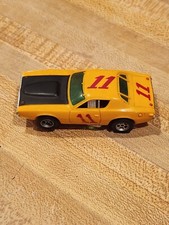 AURORA AFX 11 DODGE CHARGER STOCK CAR HO SLOT CAR 1970s IN DARK YELLOW