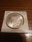 Extra Fine condition 1883 CC Morgan Dollar with die break line error