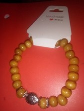 Beautiful Handmade Wooden Bead Bracelet With Silver Colored Focal Bead