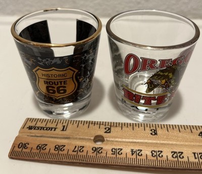 VTG (2) 1.5 oz SHOT GLASSES ROUTE 66 & OREGON  Bite Me Bait Co.  Gold Rims/Trim