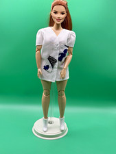 Hand-sewn mini dress with patterned pockets for curvy barbie doll