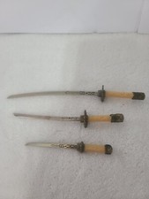 Three toy metal swords 8 1/2", 6 1/2". 5" long