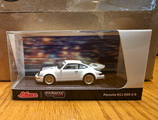 Schuco Tarmac Works Porsche 911 RSR 3.8 1:64 Diecast White/Gold w/ Case