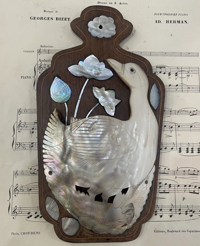 A genuine 1920s French mother-of-pearl duck-shaped fan holder is the kind of cabinet curiosity that stops every guest dead in their tracks.