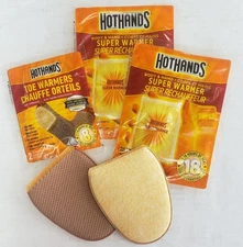"HOT HANDS" HAND - BODY - FEET WARMERS NEW IN PACKAGES plus sleeve / pockets (2)